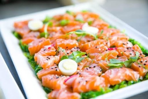 An image of a seasoned salmon sharing plate.