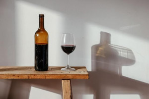 An image of a bottle and glass filled with Malbec wine