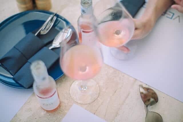 Two friends enjoying rosé wine 